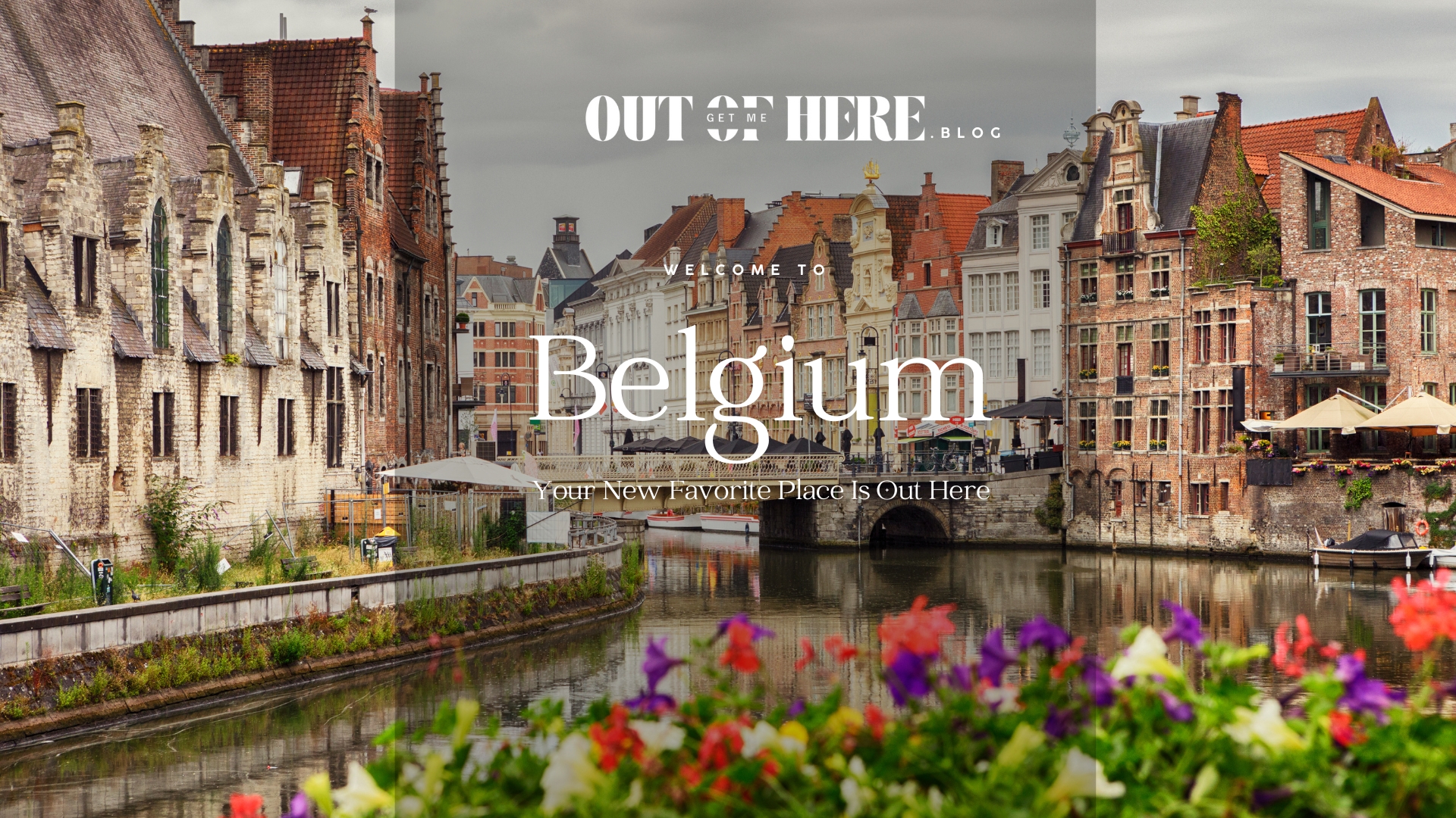 Belgium old town view with river canal, flowers and a bridge